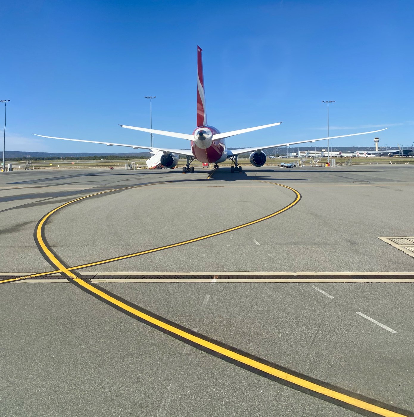 Aircraft tail on an airport taxiway before departure